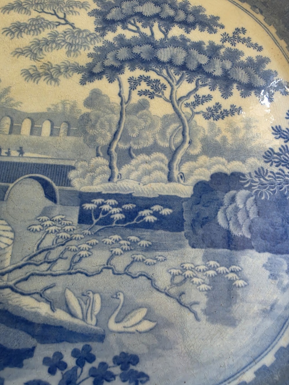 An early 19th-century octagonal Spode blue and white transferware meat platter featuring a detailed architectural landscape and floral border. View V