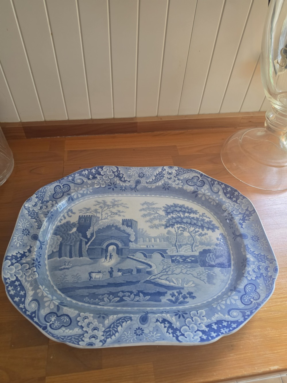 An early 19th-century octagonal Spode blue and white transferware meat platter featuring a detailed architectural landscape and floral border. View VI