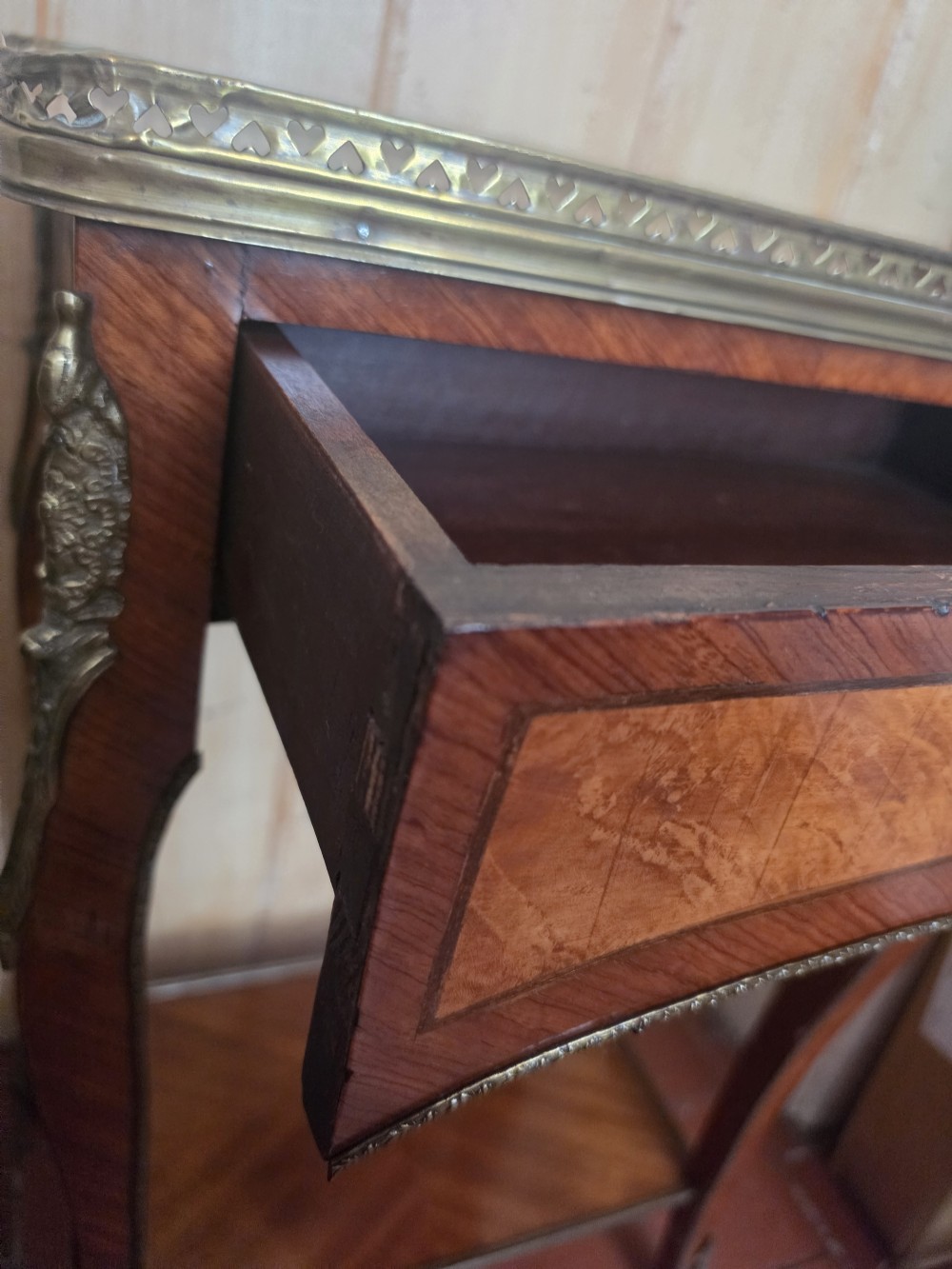 A 19th-century French style marquetry inlaid side table featuring a pierced brass gallery rim, single drawer, lower tier shelf, and cabriole legs with brass mounts. View III