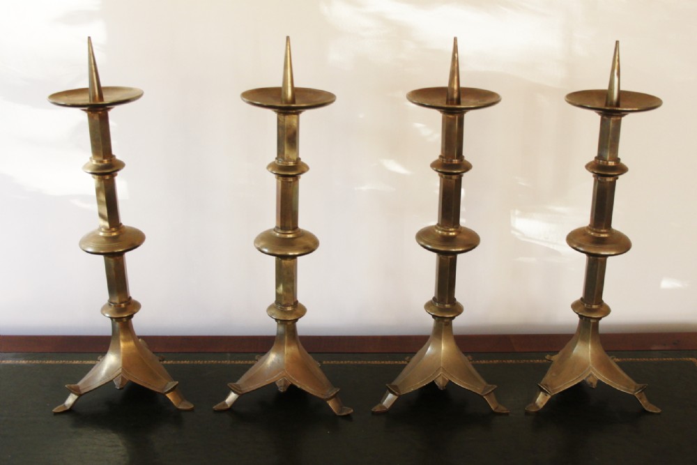 4 Gothic style brass candlesticks 