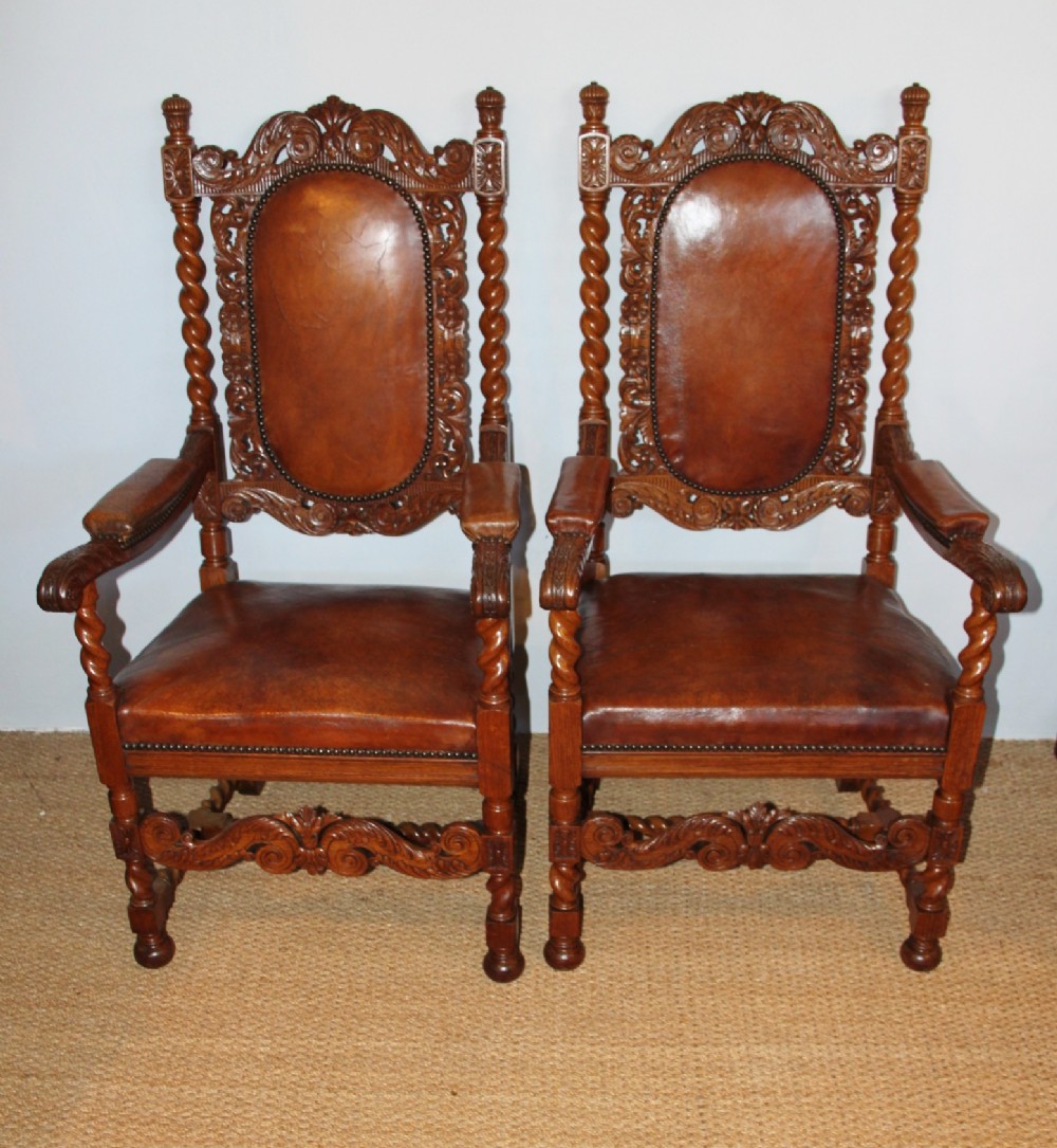 Pair of oak and leather armchairs 
