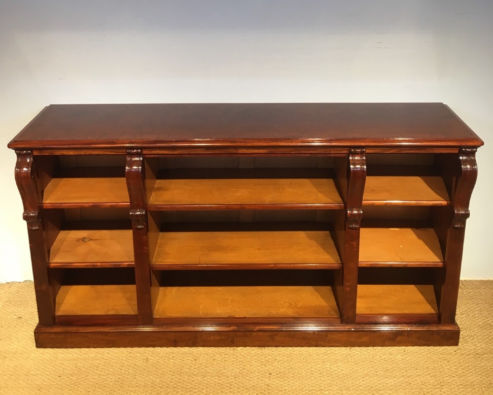 Long low mahogany bookcase  View III