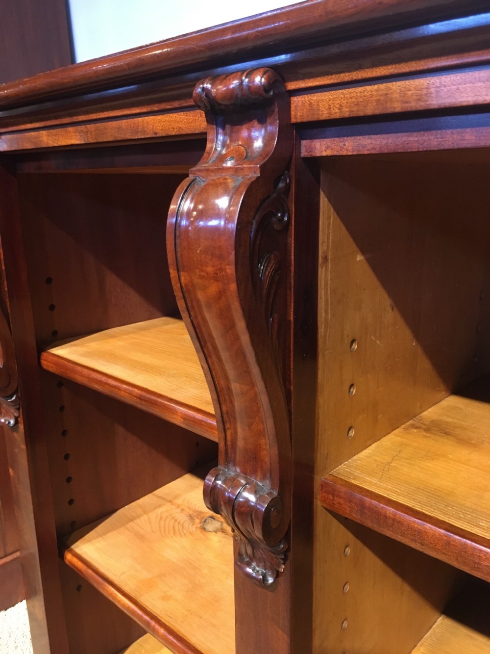 Long low mahogany bookcase  View V