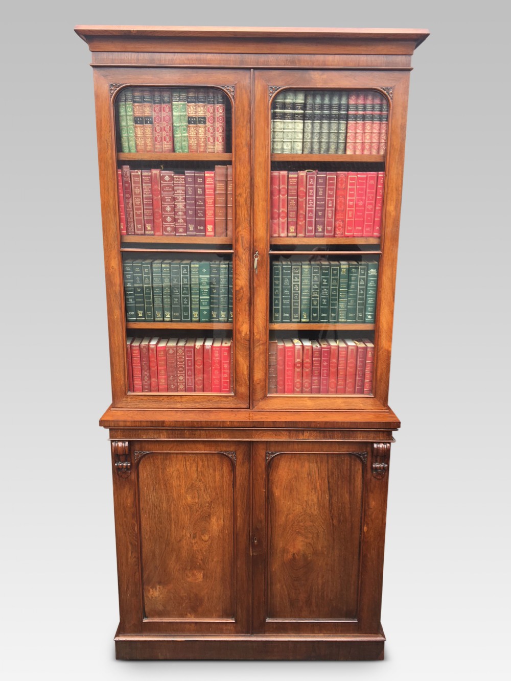 ROSEWOOD BOOKCASE OF SLIM SIZE.  ENGLISH C 1850
