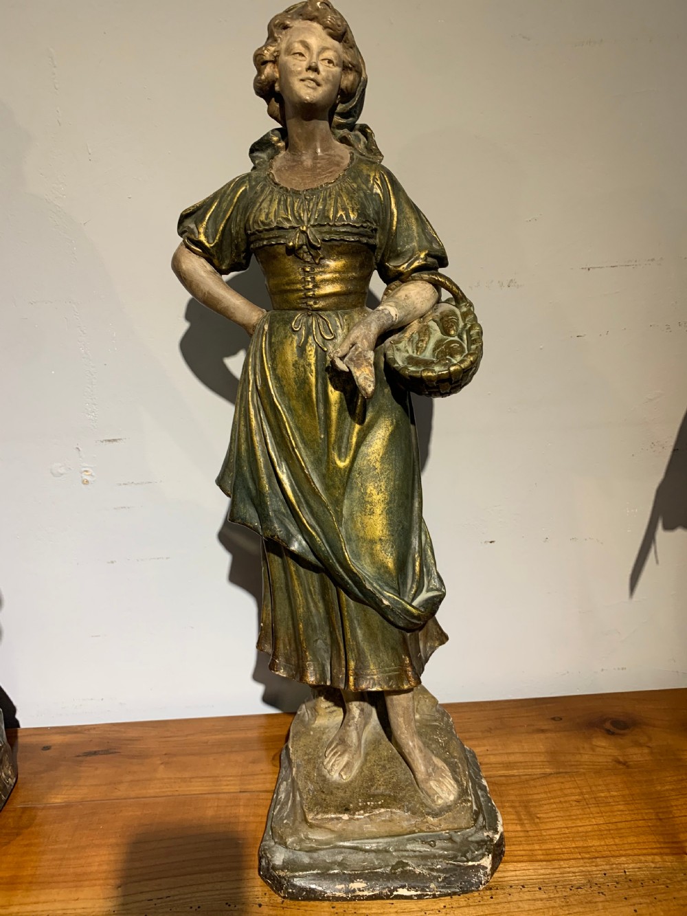 Large terracotta figure of a fish seller  