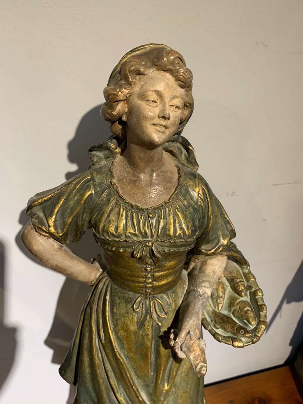Large terracotta figure of a fish seller   View II
