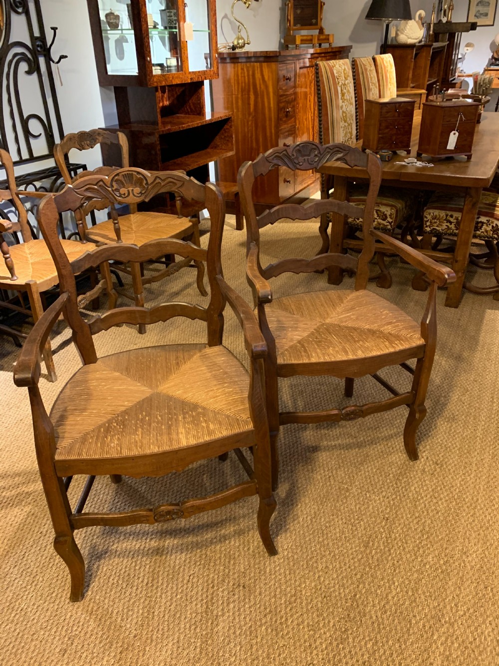 Pair of rush seated country carver chairs 
