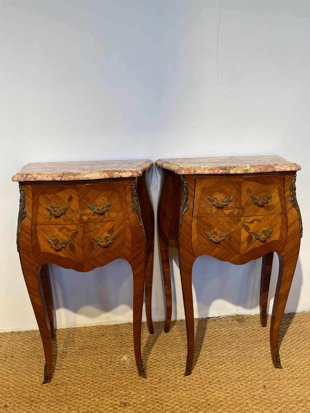 Pair of marble topped bedside cabinets 