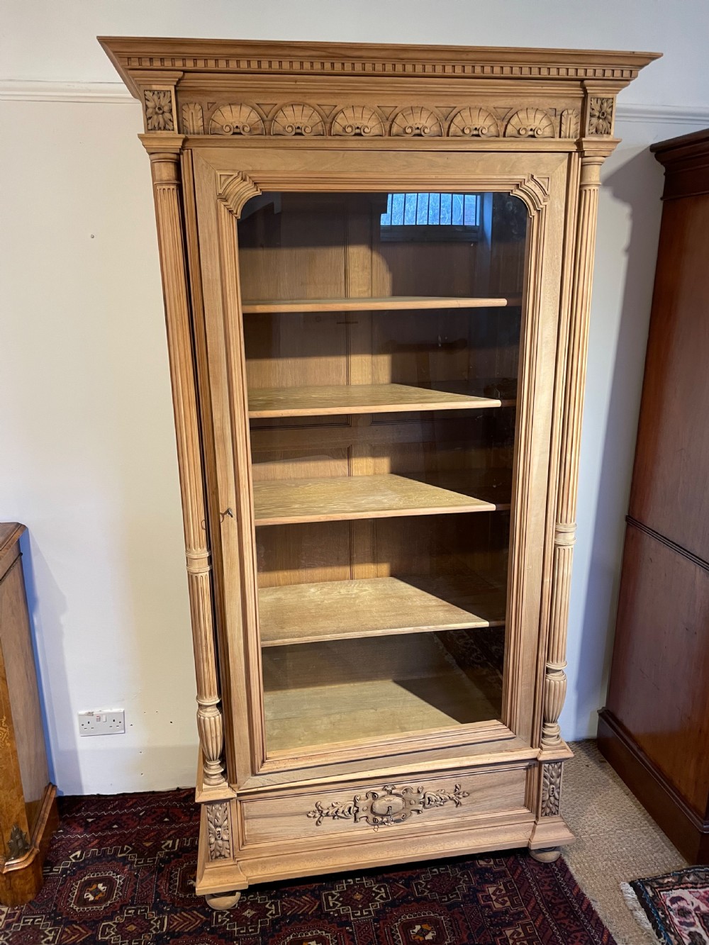Walnut single door bookcase 