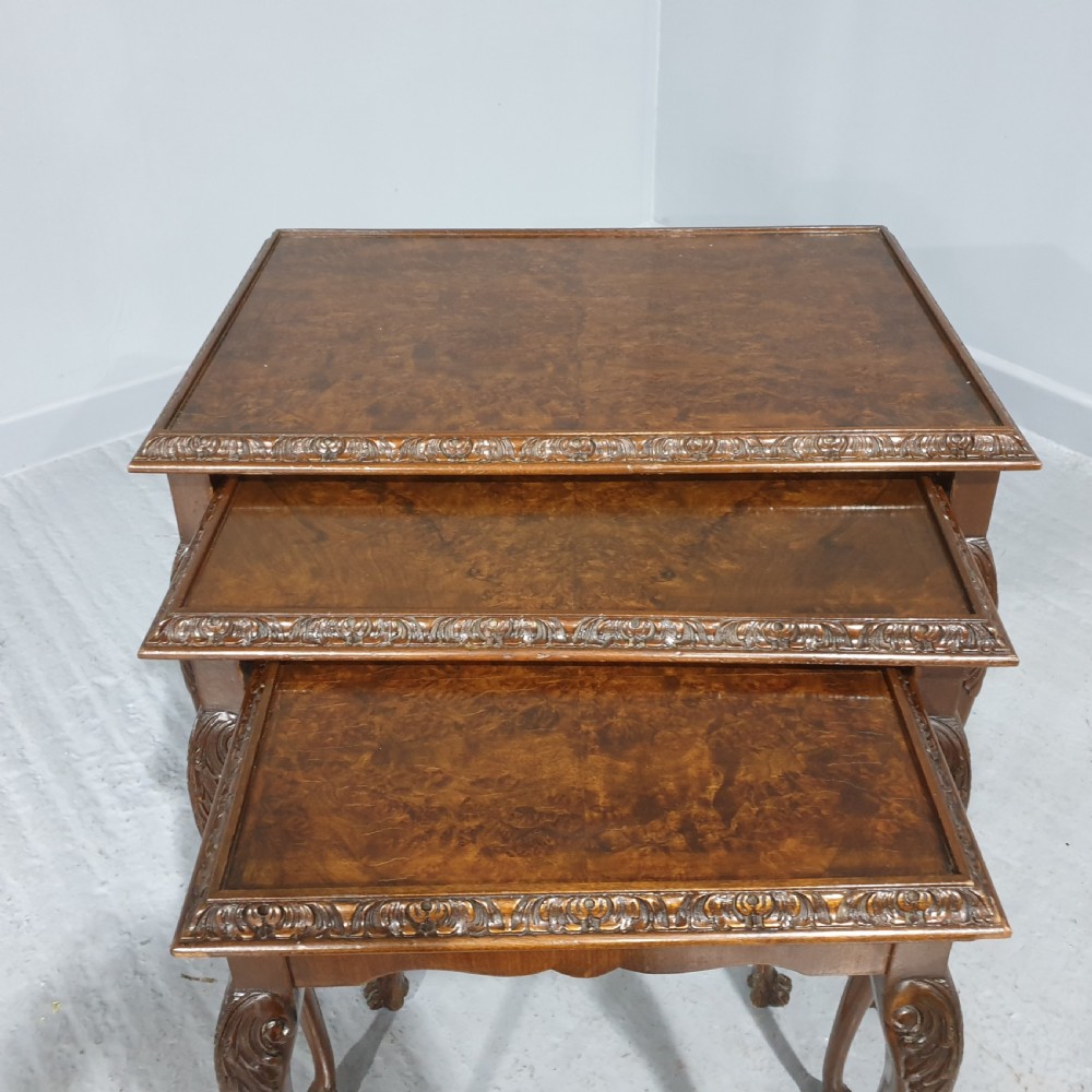 A set of three graduated burr walnut nesting tables with carved borders, cabriole legs, and claw and ball feet. View III