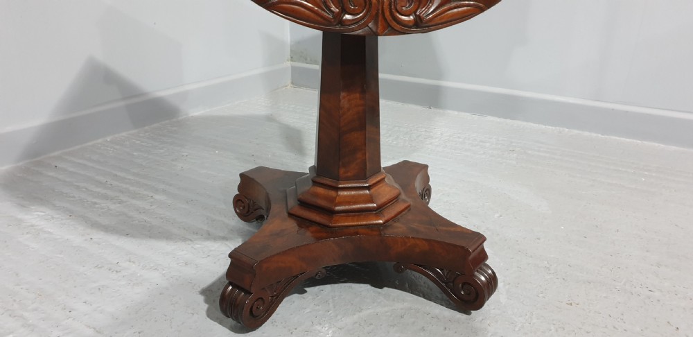 A William IV mahogany work box table featuring a single drawer over a cream fabric-lined storage well, supported on a central pedestal and quadform base with scroll feet. View III