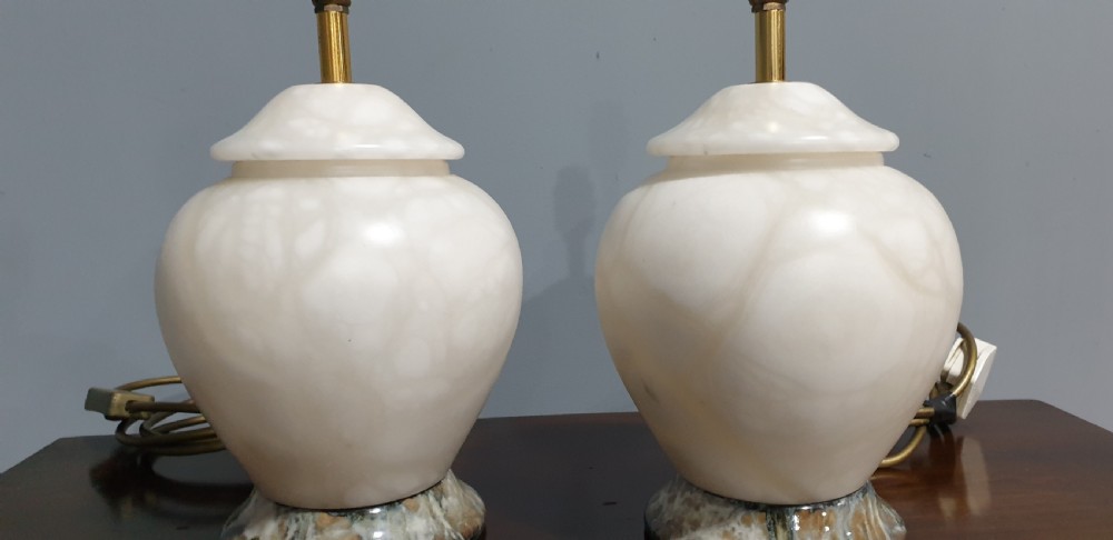 A pair of urn-shaped cream alabaster table lamps with variegated grey marble bases and brass fittings. View III