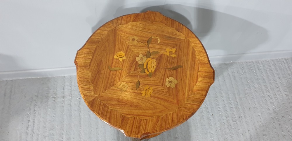 A French Louis XV style occasional table with floral marquetry inlay, slender cabriole legs, a lower tier, and gilt bronze mounts. View VI