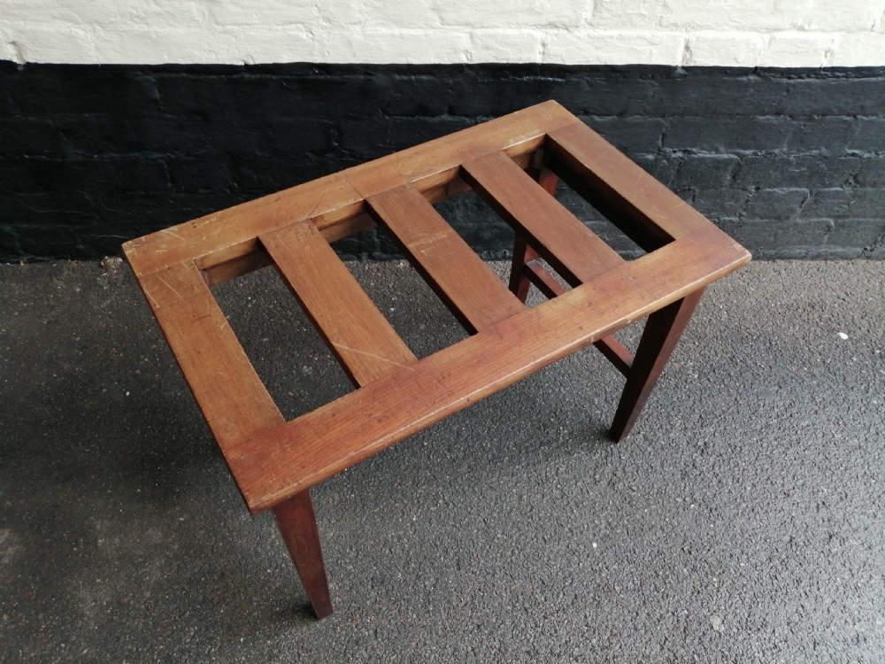 An Edwardian mahogany luggage rack featuring a slatted timber top, four square tapered legs, and lower side stretchers. View II
