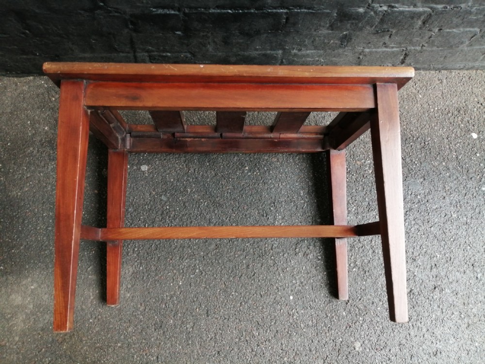 An Edwardian mahogany luggage rack featuring a slatted timber top, four square tapered legs, and lower side stretchers. View IV