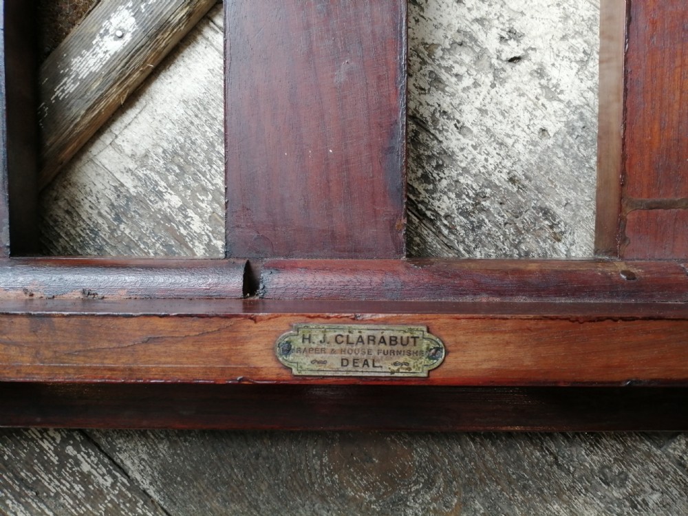An Edwardian mahogany luggage rack featuring a slatted timber top, four square tapered legs, and lower side stretchers. View V
