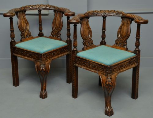 Pair of Victorian Elaborately Carved Oak Corner Chairs