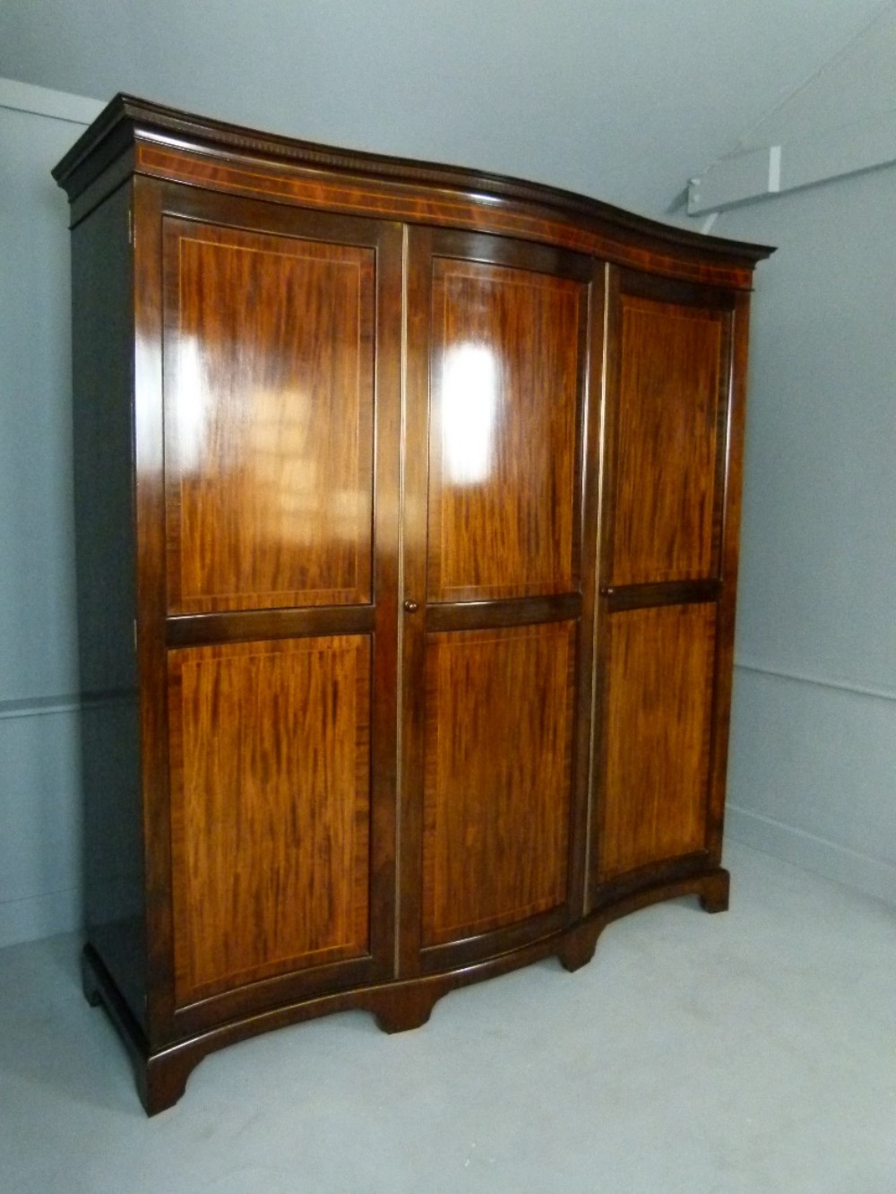 Elegant Edwardian Serpentine Mahogany Wardrobe