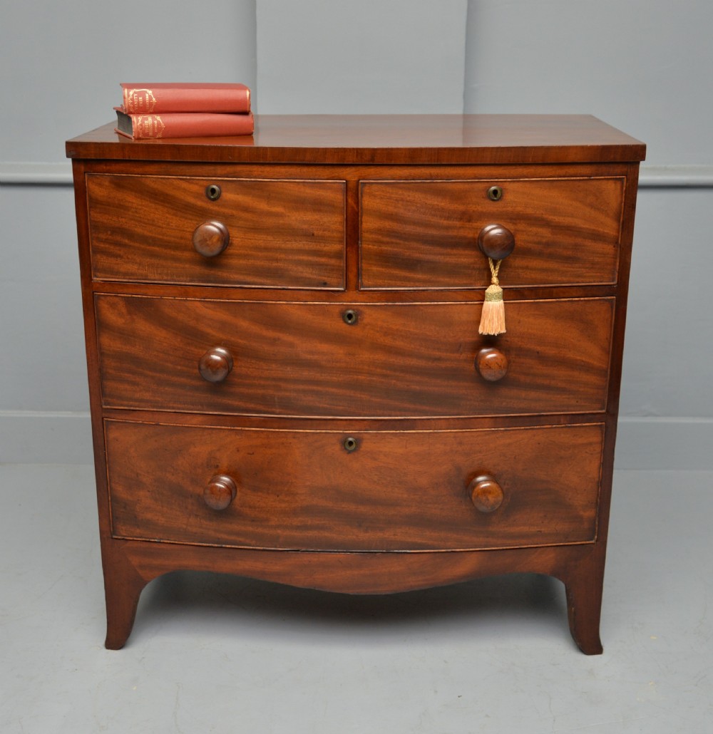 Late Georgian Flame Mahogany Small Bow-Front Chest Of Drawers View II