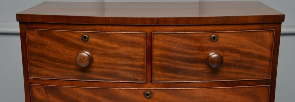 Late Georgian Flame Mahogany Small Bow-Front Chest Of Drawers View VI