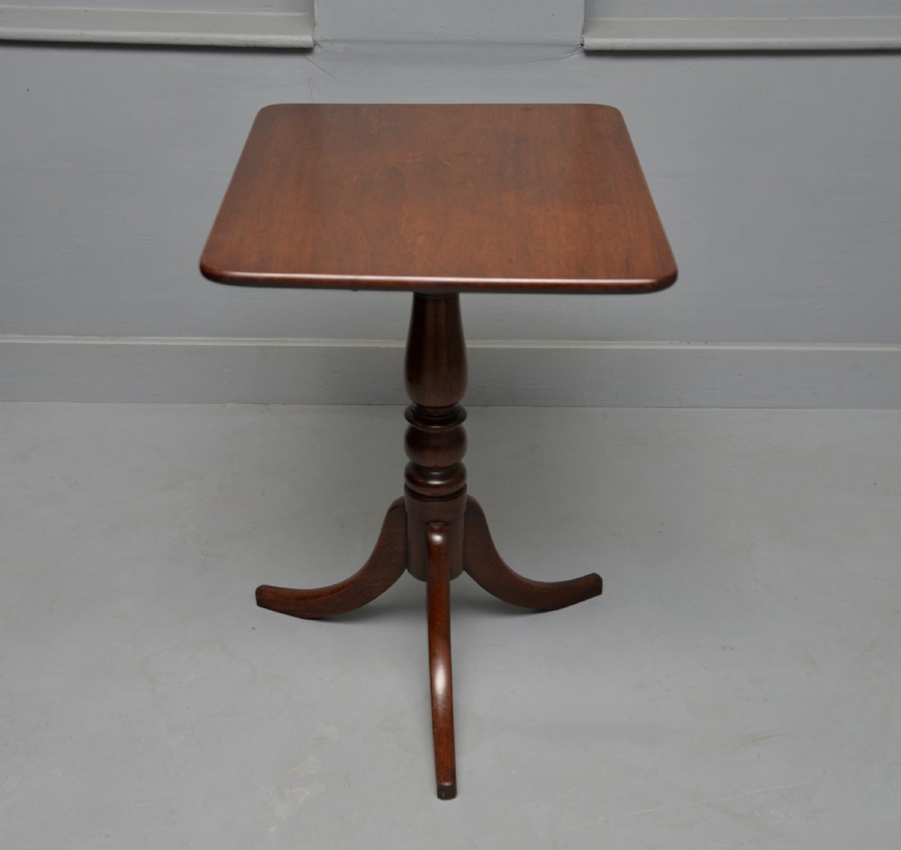 A Victorian solid mahogany wine table with a rectangular rounded top, a central turned pedestal, and a tripod base. View VIII