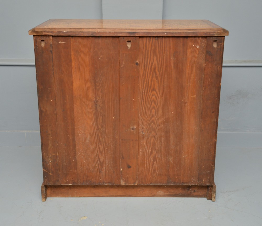 A Victorian satinwood chest of drawers featuring two small upper drawers above three full-width drawers with turned rosette knobs and a plinth base. View XXVIII