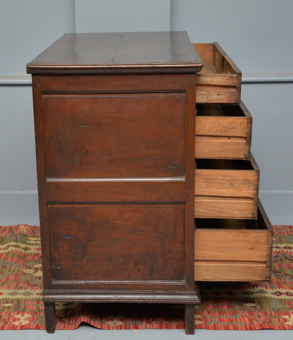 A William and Mary walnut and yew wood chest of four drawers featuring brass teardrop handles and decorative bead moulding. View XI