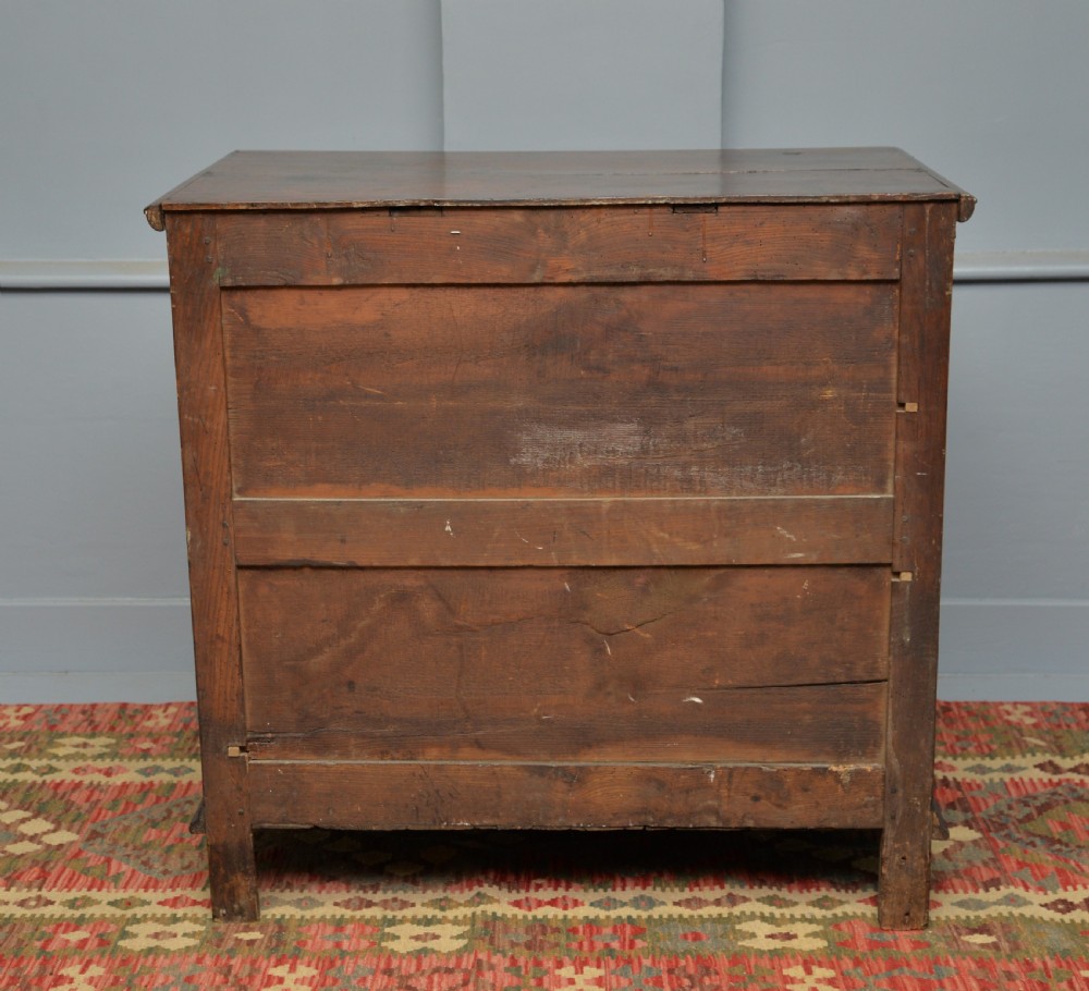 A William and Mary walnut and yew wood chest of four drawers featuring brass teardrop handles and decorative bead moulding. View XIII
