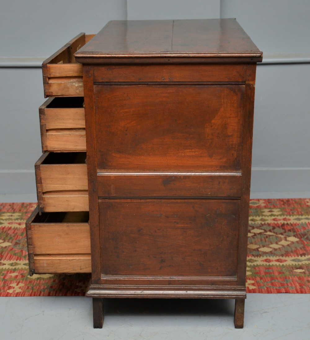 A William and Mary walnut and yew wood chest of four drawers featuring brass teardrop handles and decorative bead moulding. View XIV