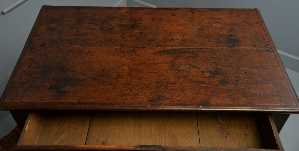 A William and Mary walnut and yew wood chest of four drawers featuring brass teardrop handles and decorative bead moulding. View XVII