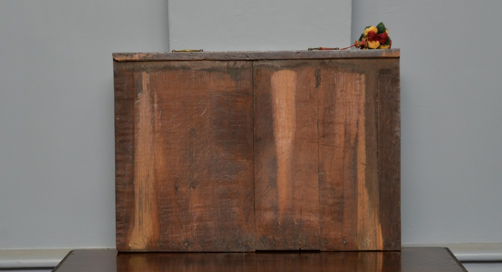 A dark carved oak side table featuring a single scroll-carved frieze drawer, turned legs, and a lower stretcher frame. View XX