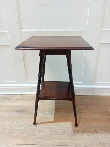 An antique dark wood Arts and Crafts side table featuring turned legs, a square top, and a lower tier shelf. View II