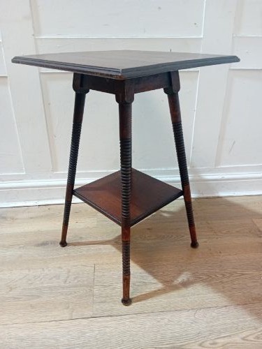 An antique dark wood Arts and Crafts side table featuring turned legs, a square top, and a lower tier shelf. View IX