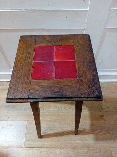 A tall Arts and Crafts dark oak jardiniere stand featuring four red ceramic tiles inset on the top surface and slim tapered legs. View XII