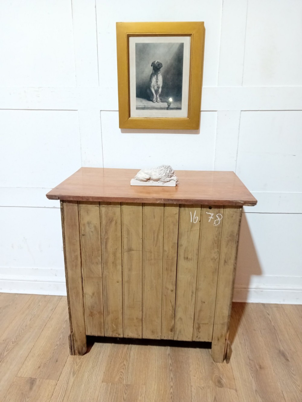 A late nineteenth-century satinwood chest of drawers with three full-width drawers and dark metal drop handles. View X