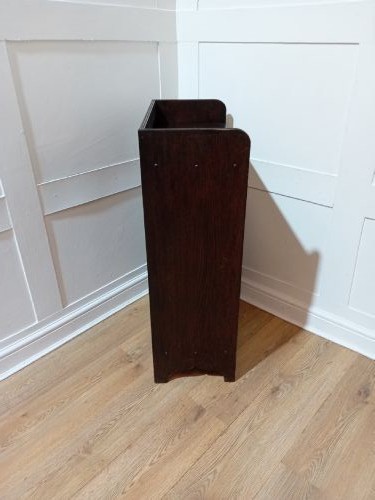 A dark oak Arts and Crafts dwarf glazed cabinet featuring twin leaded glass doors and a gallery top upstand. View XIV