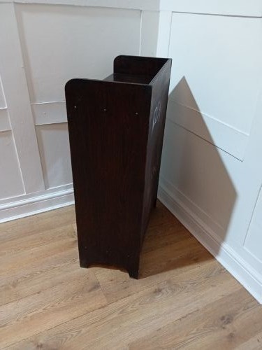 A dark oak Arts and Crafts dwarf glazed cabinet featuring twin leaded glass doors and a gallery top upstand. View XII