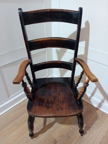 A Victorian Thames Valley Oxford wooden armchair featuring a three-slat ladder back, shaped wooden armrests, a contoured wooden seat, and turned legs with a dark patinated finish. View III