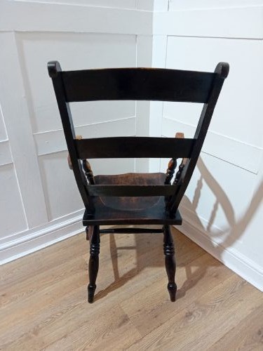 A Victorian Thames Valley Oxford wooden armchair featuring a three-slat ladder back, shaped wooden armrests, a contoured wooden seat, and turned legs with a dark patinated finish. View V