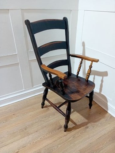 A Victorian Thames Valley Oxford wooden armchair featuring a three-slat ladder back, shaped wooden armrests, a contoured wooden seat, and turned legs with a dark patinated finish. View VII