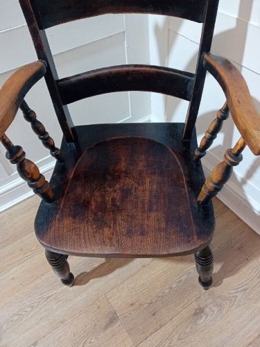 A Victorian Thames Valley Oxford wooden armchair featuring a three-slat ladder back, shaped wooden armrests, a contoured wooden seat, and turned legs with a dark patinated finish. View VIII