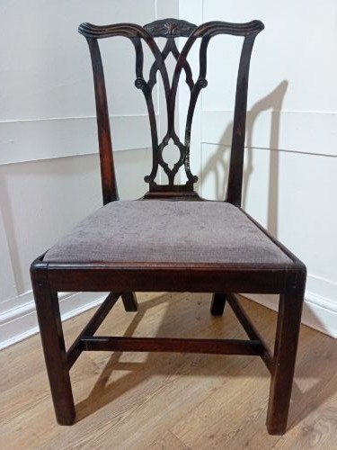 An 18th-century George III mahogany side chair featuring a carved pierced splat back, upholstered drop-in seat, and straight square legs with H-stretcher support. View II