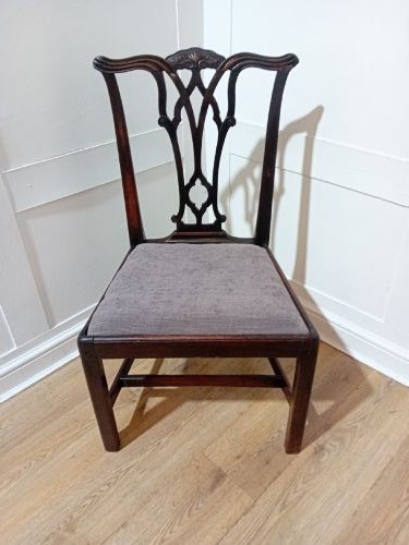 An 18th-century George III mahogany side chair featuring a carved pierced splat back, upholstered drop-in seat, and straight square legs with H-stretcher support. View IV