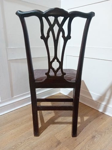 An 18th-century George III mahogany side chair featuring a carved pierced splat back, upholstered drop-in seat, and straight square legs with H-stretcher support. View IX