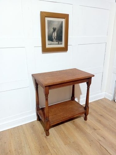 A late Victorian medium brown oak side table featuring a rectangular top, an open lower shelf, and four slender turned wooden legs. View VI