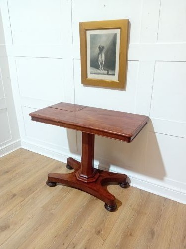An antique Victorian mahogany reading table featuring a dual tilting ratcheted top on a turned pedestal column and quadripartite base. View III