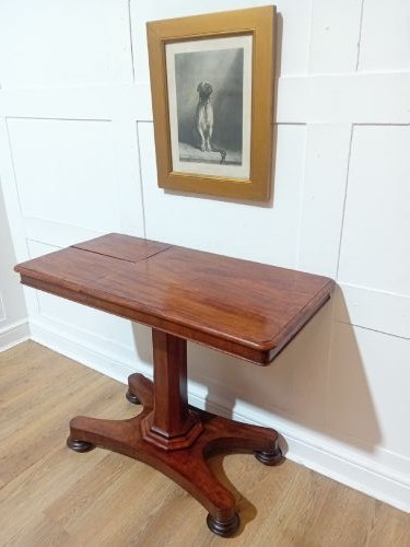 An antique Victorian mahogany reading table featuring a dual tilting ratcheted top on a turned pedestal column and quadripartite base. View V