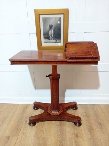 An antique Victorian mahogany reading table featuring a dual tilting ratcheted top on a turned pedestal column and quadripartite base. View XII