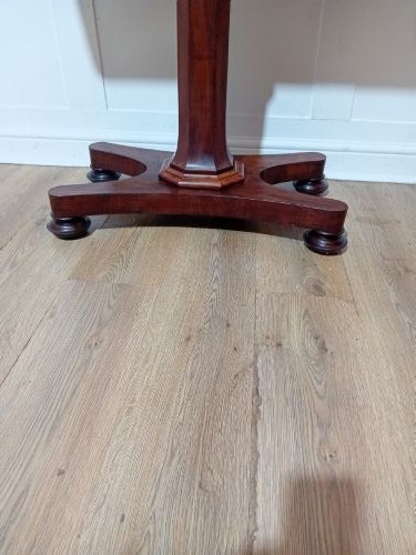 An antique Victorian mahogany reading table featuring a dual tilting ratcheted top on a turned pedestal column and quadripartite base. View XIII