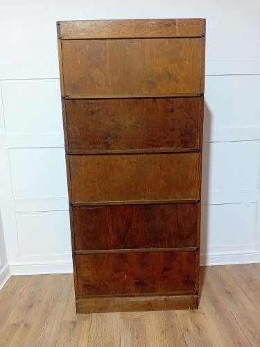 An Edwardian golden oak five-tier sectional barrister bookcase featuring glazed lifting doors with brass handles and a moulded top cornice. View XIII